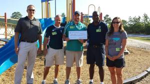 UNCW Coaches with Coach Kelli and myself and their donation check.